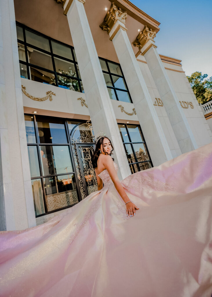 Candid Quinceañera gown portrait captured at Leonard’s Palazzo, featuring natural expression and elegant styling.