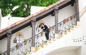 Elegant Vanderbilt Mansion wedding portraits featuring the bride and groom on the grand staircase—timeless Gold Coast romance captured with classic style.