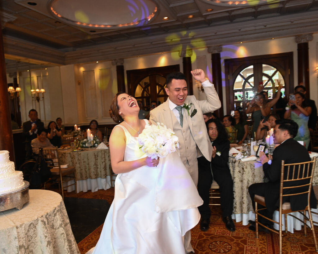 Bride and groom dancing during grand reception entrance at Long Island ballroom Westbury manor