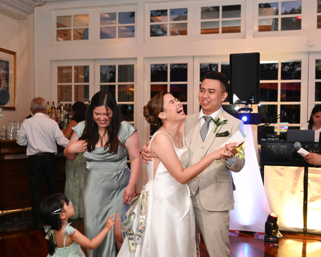 Bride and groom spinning during first dance in Long Island ballroom Westbury Manor