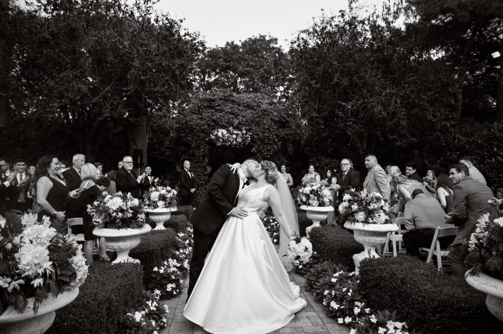 Bride and groom entering reception through doors at Westbury Manor wedding