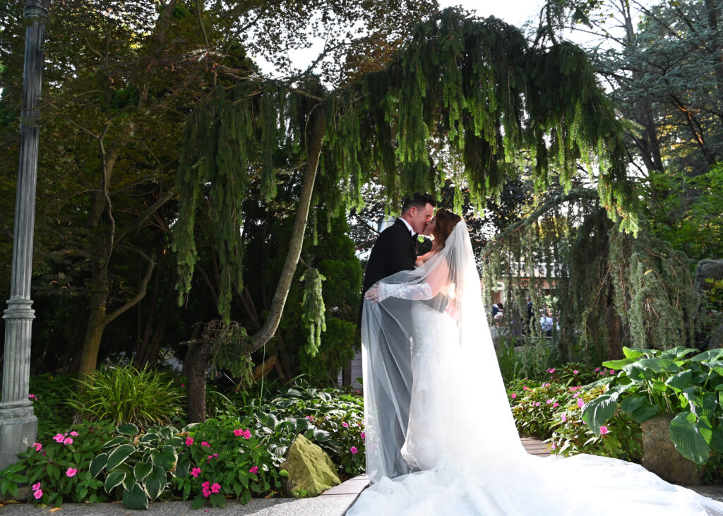 Bride and groom evening portrait in Westbury Manor gardens