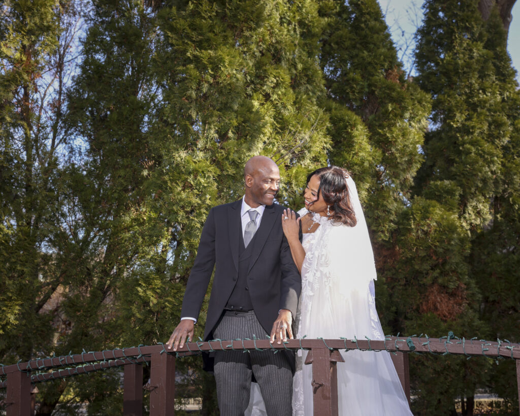 Bride and groom romantic walki together on Westbury Manor grounds Long Island