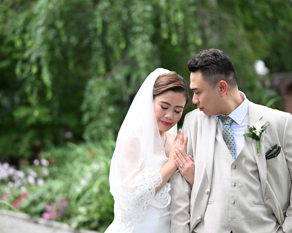 Bride and groom portrait in greenery at Westbury Manor Long Island