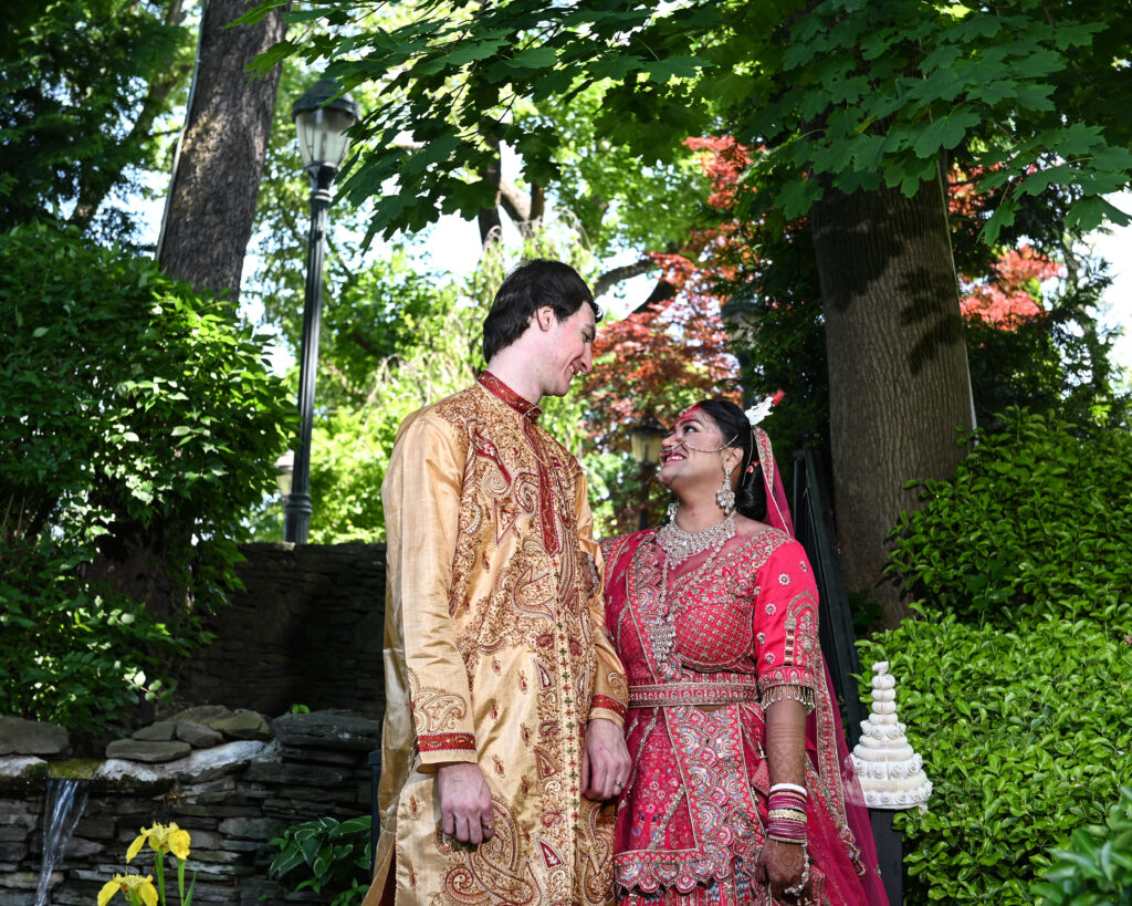 South Asian bride and groom in traditional attire at Westbury Manor wedding