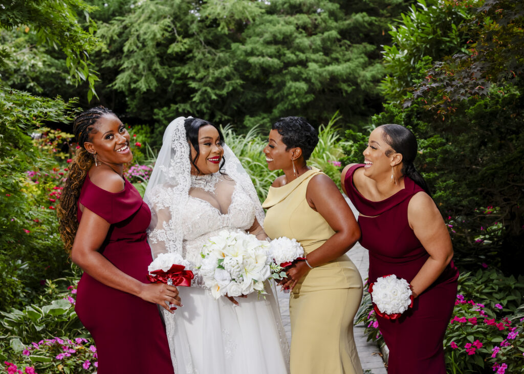 Bride with bridesmaids in Westbury Manor garden Long Island wedding