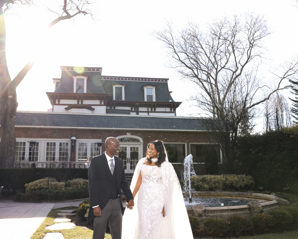 Bride alone outside Westbury Manor mansion Long Island wedding venue
