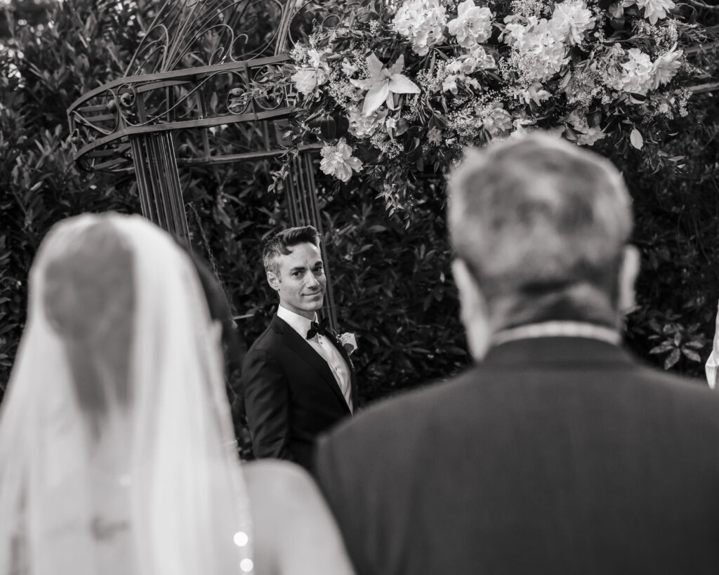 Bride and groom black and white portrait during Westbury Manor wedding ceremony