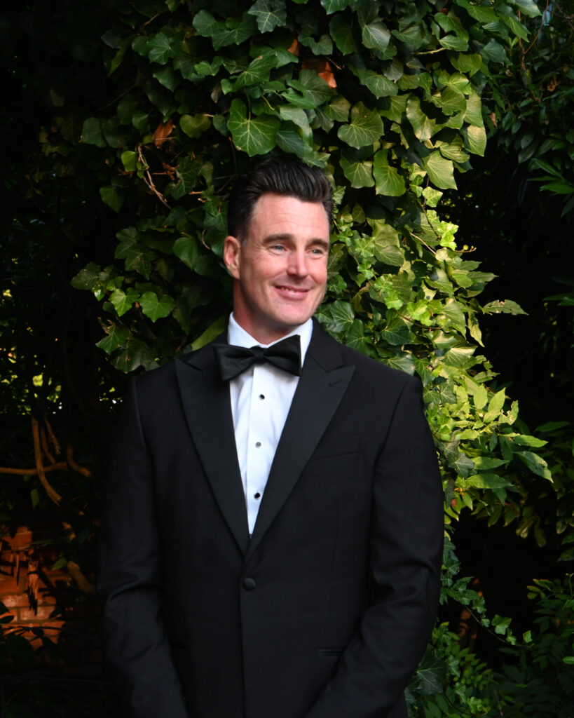 Groom portrait in Westbury Manor gardens Long Island NY wedding