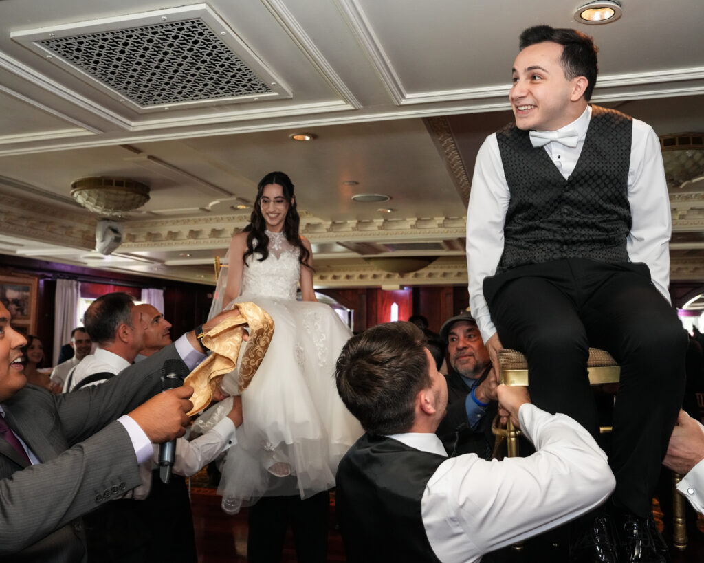 Bride lifted during reception dancing at Westbury Manor ballroom Long Island