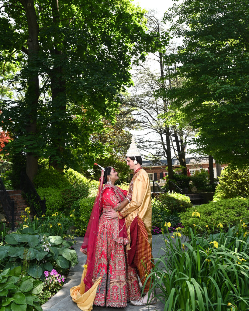 South Asian wedding ceremony under floral mandap at Westbury Manor Long Island