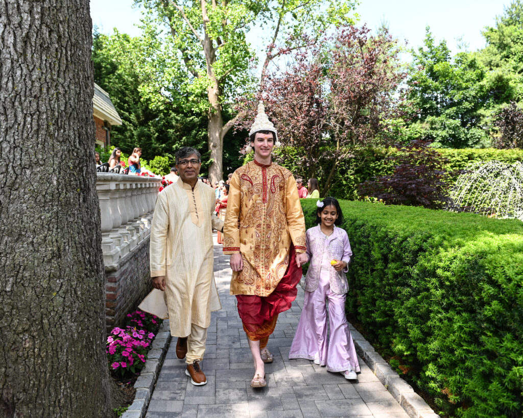 South Asian bride walking through Westbury Manor gardens Long Island NY