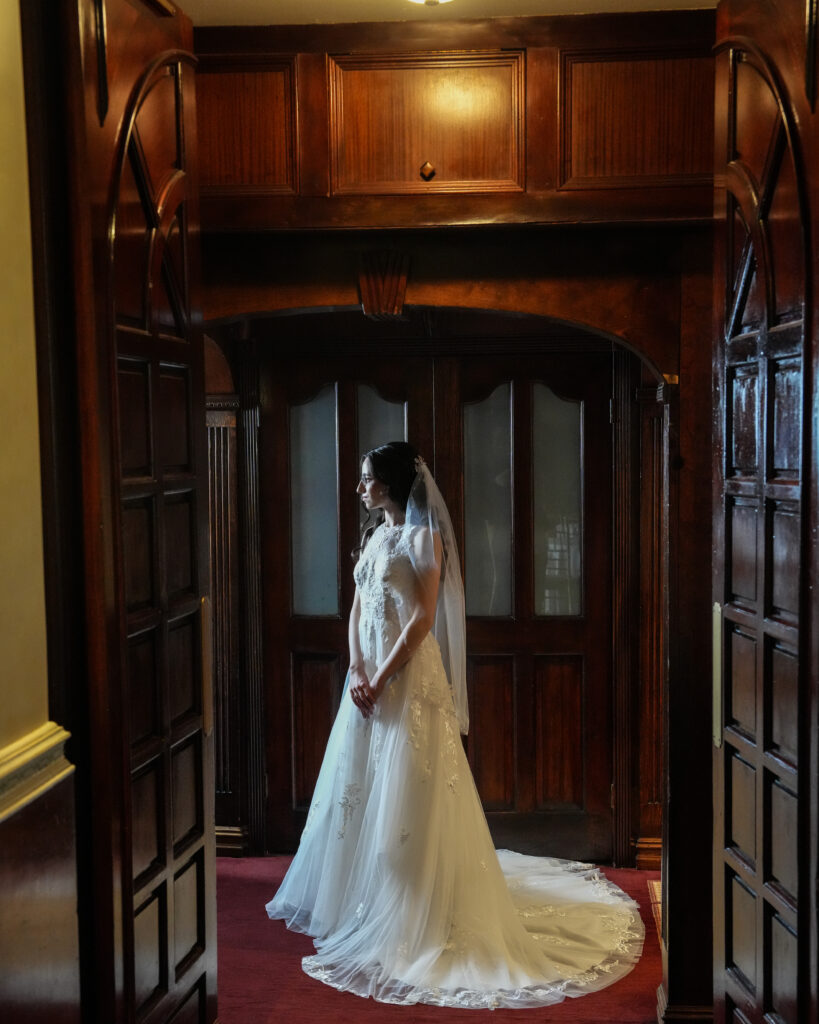 Bride and groom exchanging vows outdoors at Westbury Manor Long Island