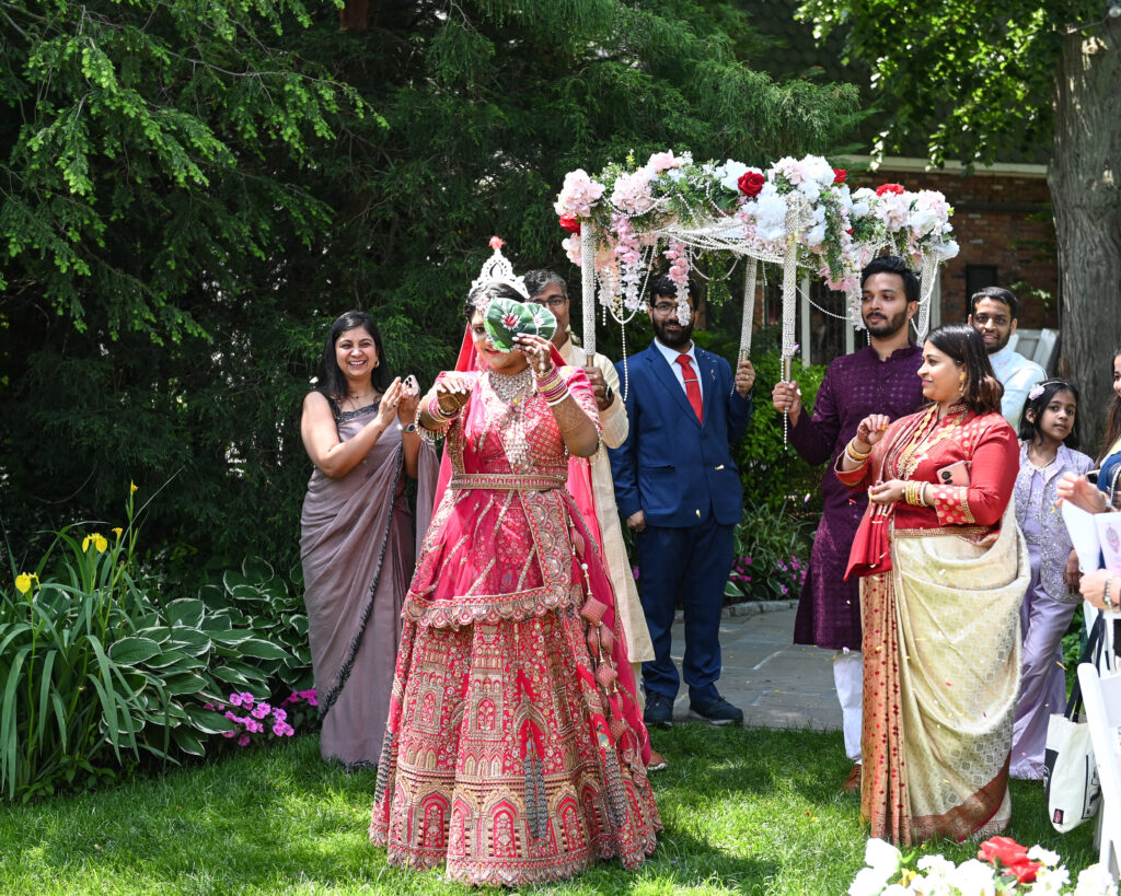 South Asian bride posing in Westbury Manor gardens Long Island NY