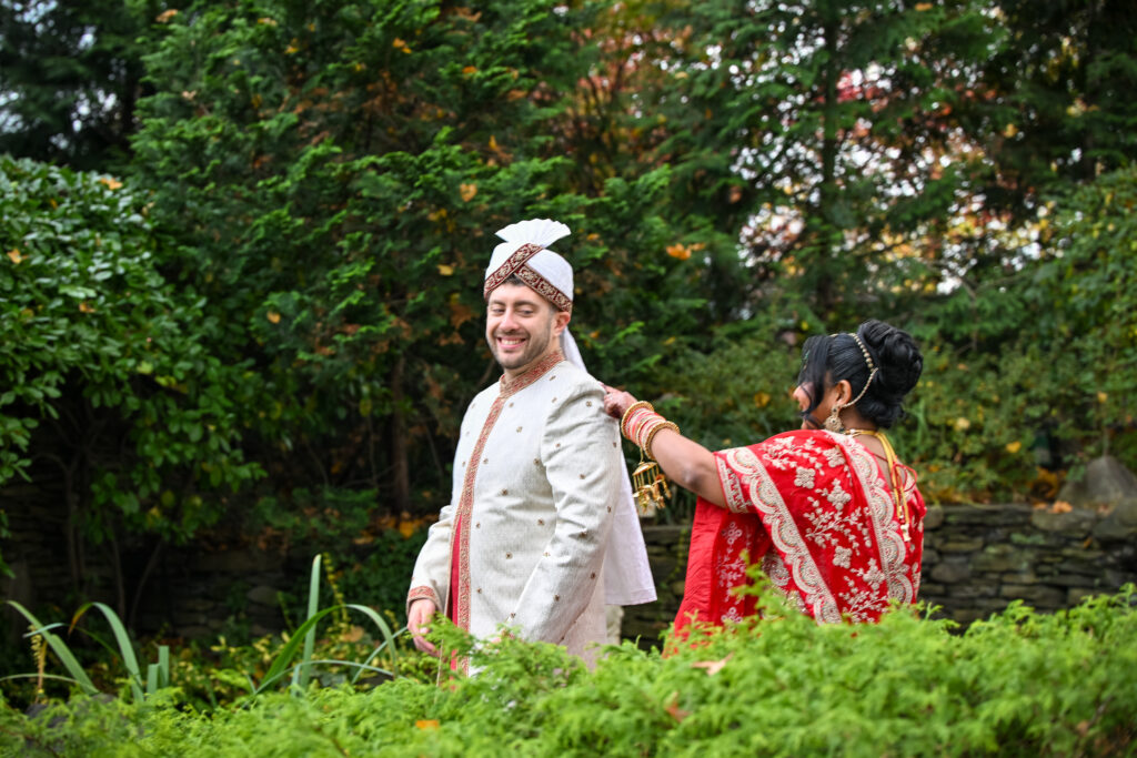 South Asian bride and groom walking in Westbury Manor Long Island