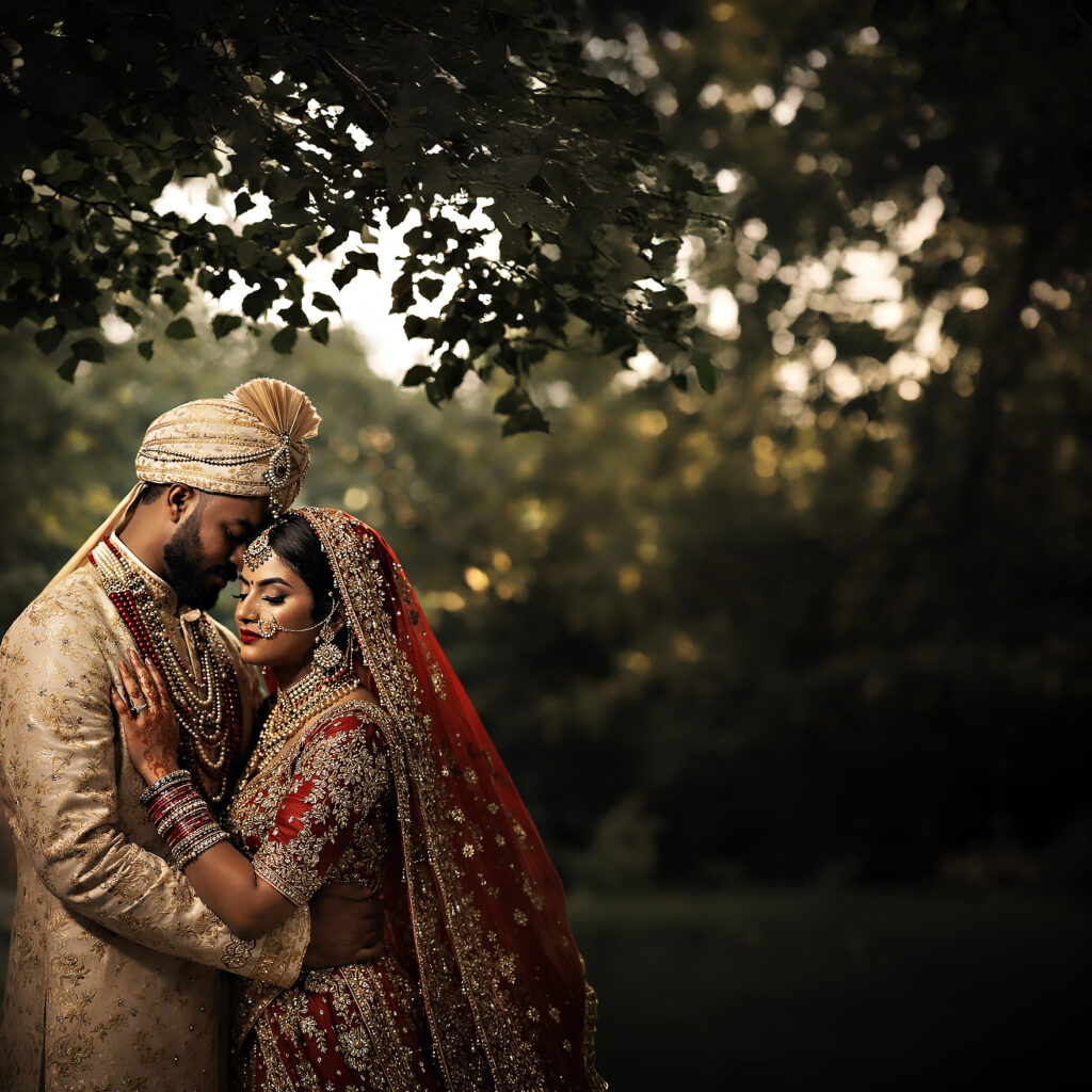 South Asian bride and groom embracing in Westbury Manor gardens Long Island