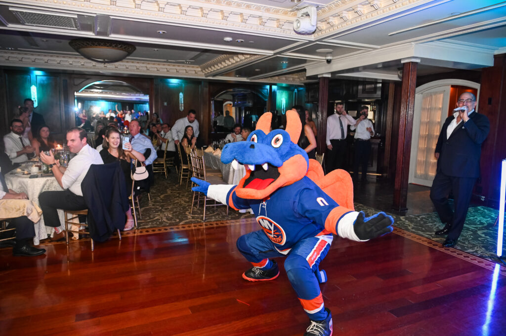 Islander Mascot Sparky dancing during Westbury Manor wedding reception Long Island ballroom