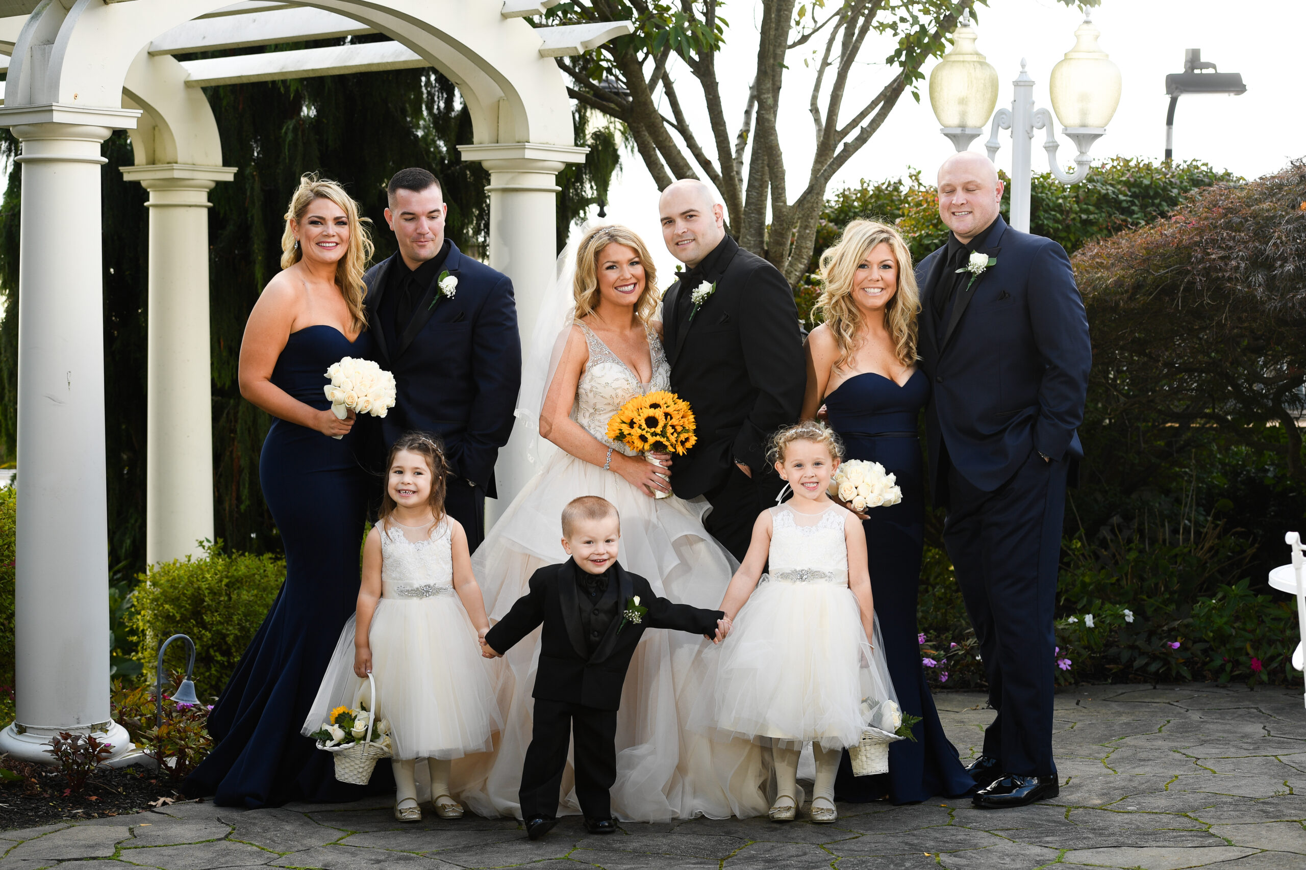 Wedding party group portrait outdoors at Flowerfield St. James NY
